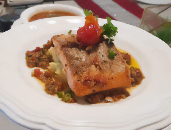 Marinated Salmon Fillet with Crushed Potatoes, Confit Red Pepper Jus, Garlic, and Ginger